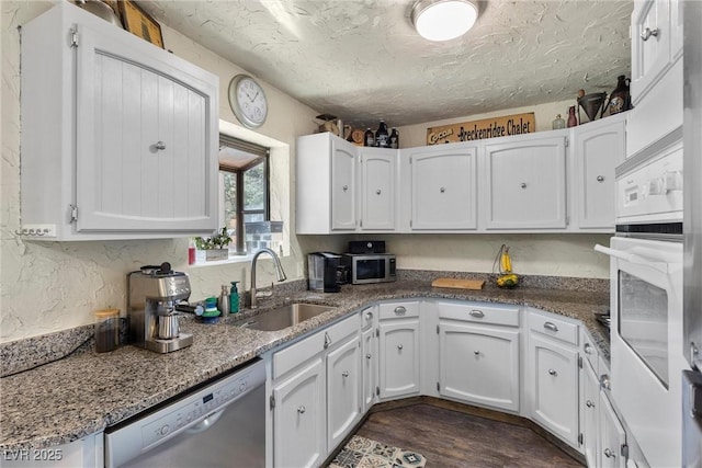 kitchen featuring white cabinetry, stainless steel appliances, and sink