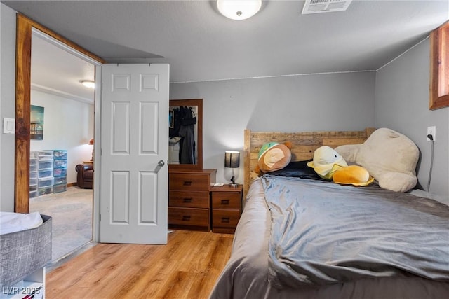 bedroom with light hardwood / wood-style floors