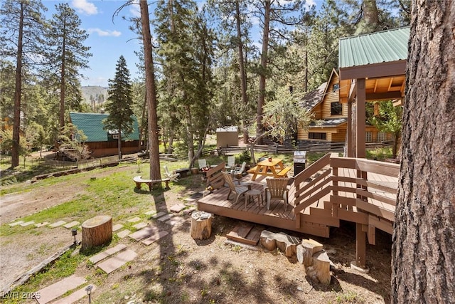 view of yard featuring a wooden deck