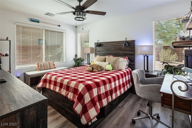 bedroom featuring ceiling fan and dark wood-type flooring