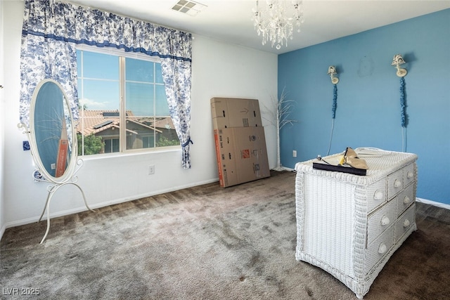 interior space featuring carpet floors and a notable chandelier