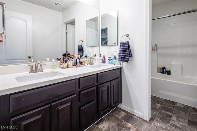 bathroom with shower / bathtub combination and vanity