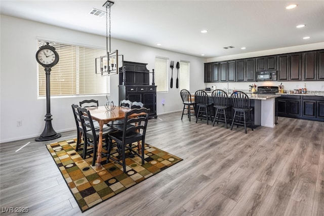 dining area featuring light wood-type flooring