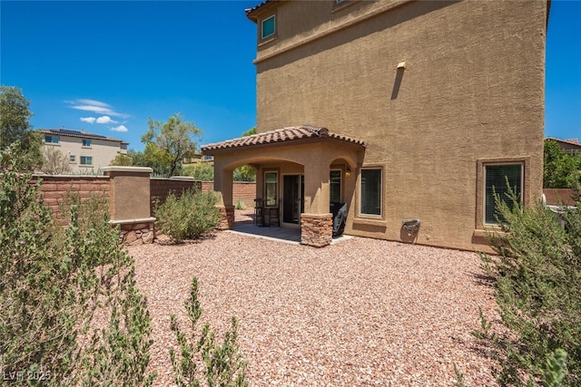 rear view of house with a patio