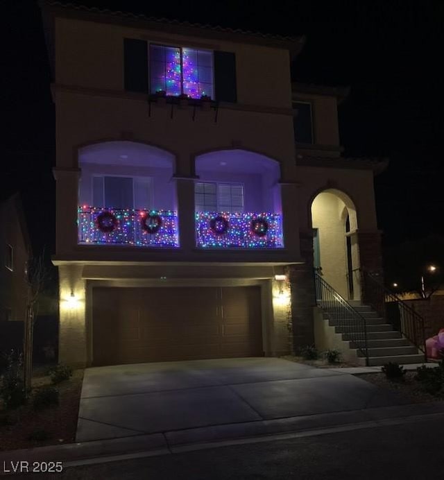 mediterranean / spanish-style home with a garage