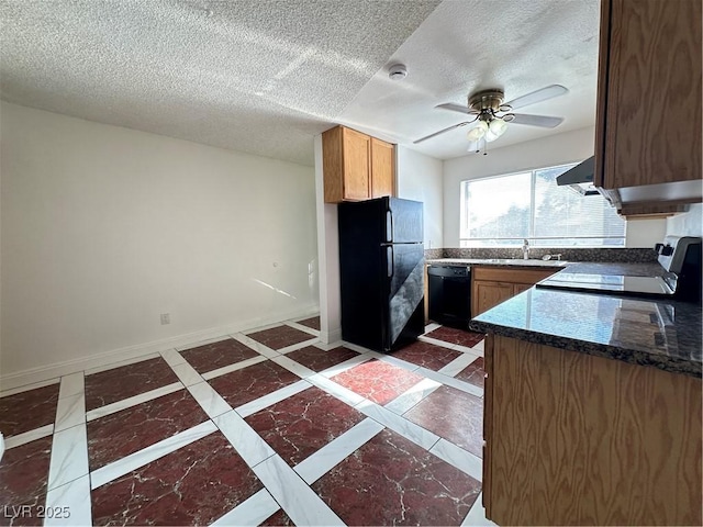 kitchen with black appliances, ceiling fan, range hood, and a textured ceiling