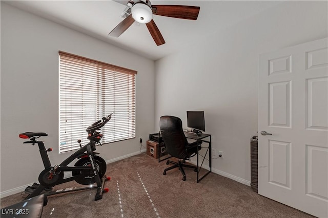 home office featuring ceiling fan, a wealth of natural light, and carpet