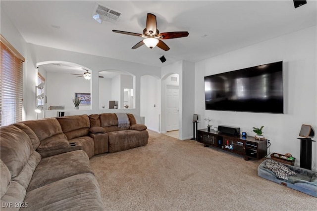 living room with ceiling fan and light carpet