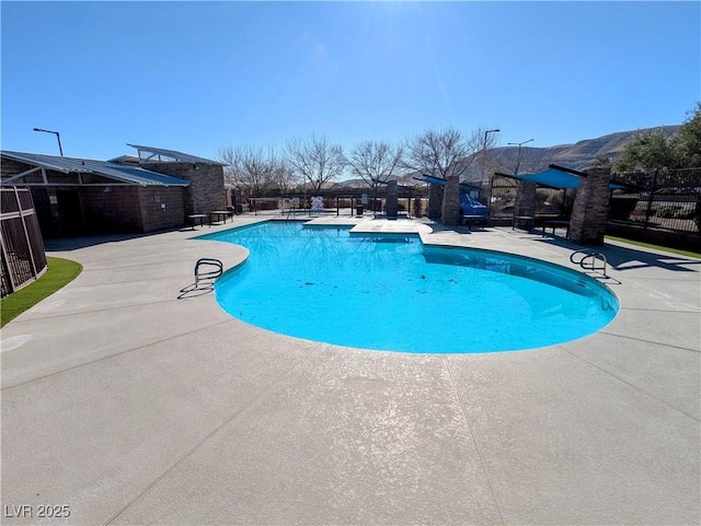 view of swimming pool featuring a patio area