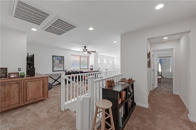 hallway with light colored carpet