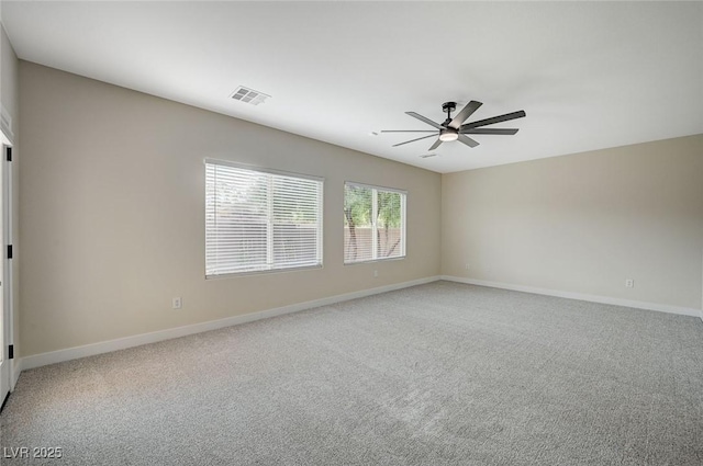 unfurnished room featuring ceiling fan and carpet