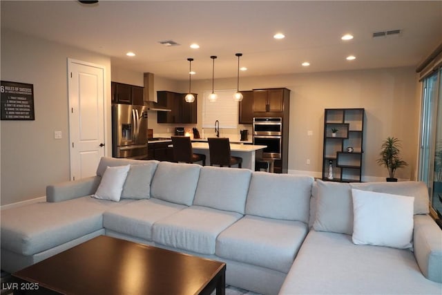 living room featuring sink