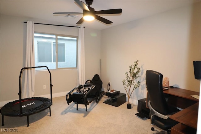 carpeted office with ceiling fan