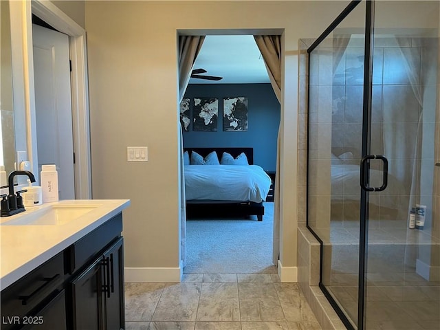 bathroom with an enclosed shower, vanity, tile patterned flooring, and ceiling fan