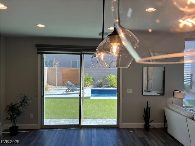 doorway to outside featuring dark hardwood / wood-style flooring