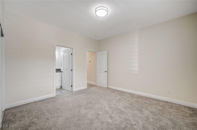 unfurnished bedroom featuring light carpet