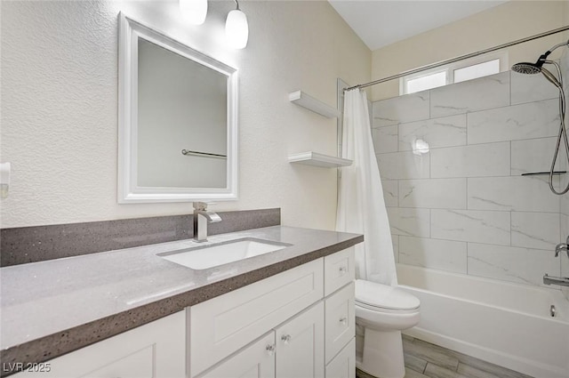 full bathroom with shower / bath combo with shower curtain, hardwood / wood-style floors, toilet, and vanity