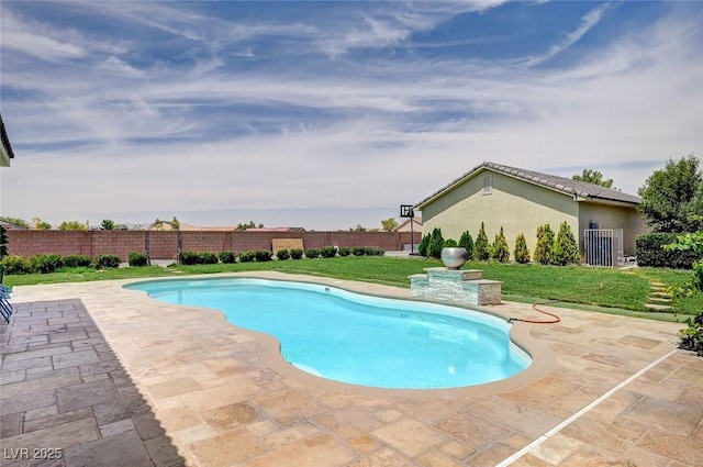 view of swimming pool with a lawn and a patio