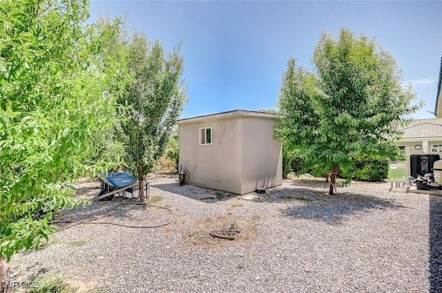 view of property exterior featuring an outdoor structure