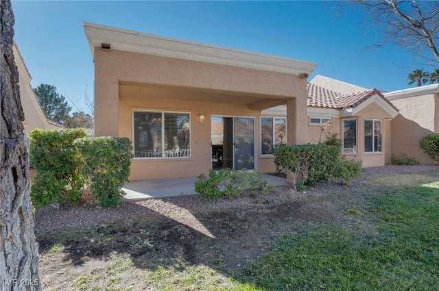 back of property featuring a patio area