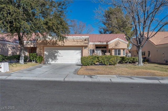 view of front of house with a front yard and a garage