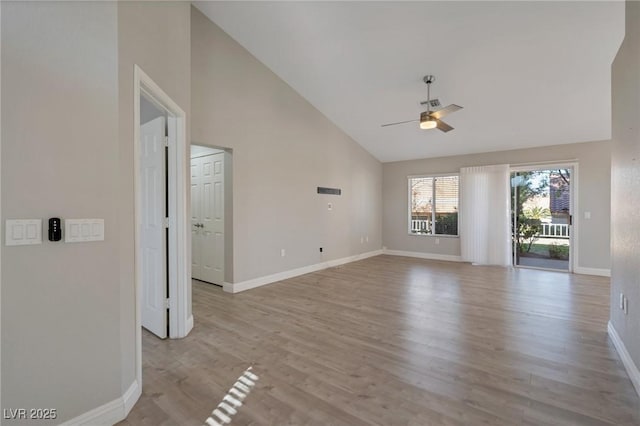 unfurnished living room featuring high vaulted ceiling, light wood-type flooring, and ceiling fan