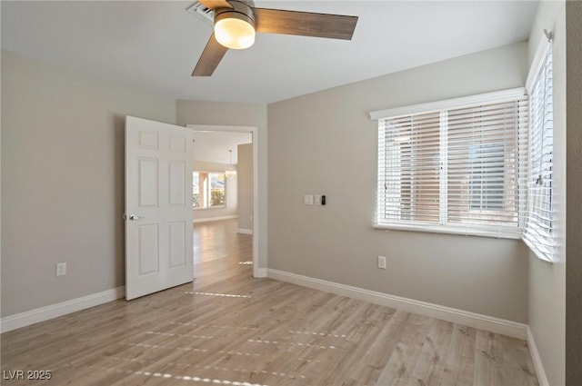 unfurnished bedroom with ceiling fan and light hardwood / wood-style floors