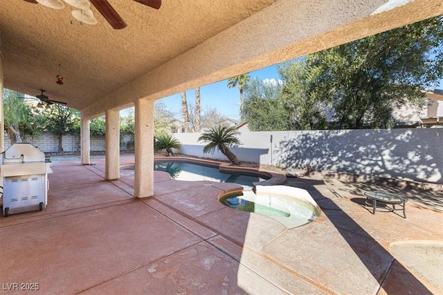 view of patio / terrace featuring a fenced in pool and area for grilling