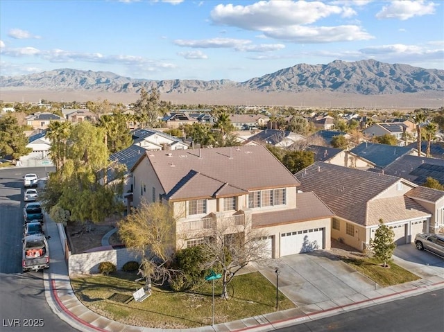 birds eye view of property with a mountain view