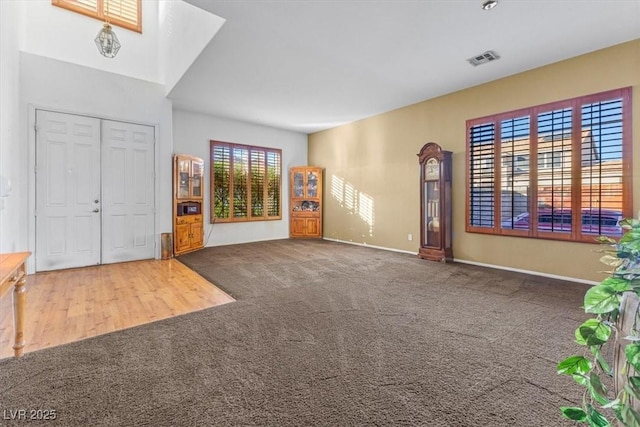 entryway with carpet floors