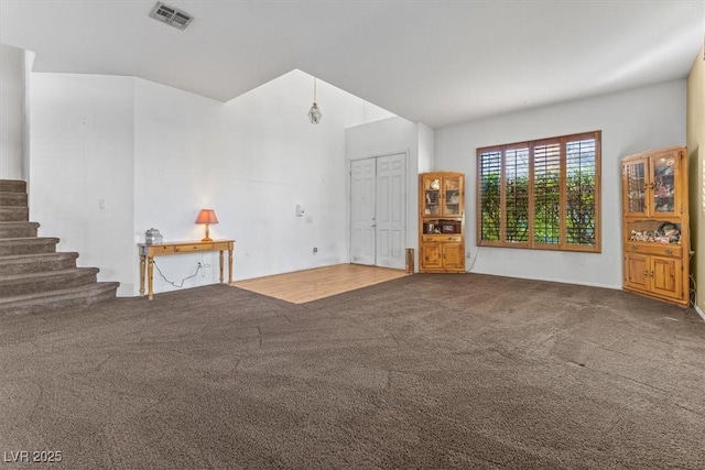 unfurnished living room with carpet