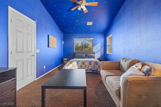 carpeted bedroom with vaulted ceiling and ceiling fan