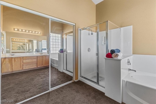 bathroom with vanity and independent shower and bath