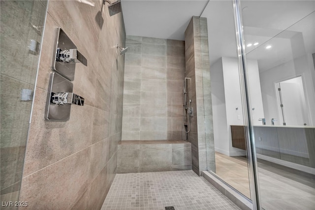 bathroom with a tile shower