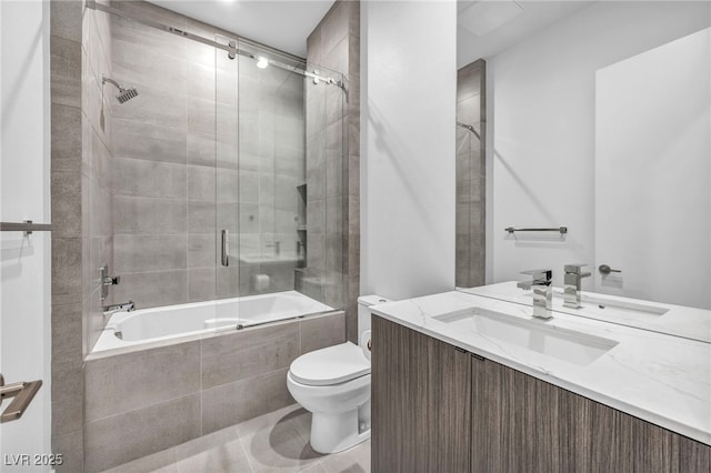 full bathroom featuring vanity, toilet, and combined bath / shower with glass door