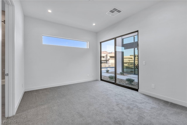 spare room featuring carpet flooring