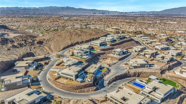 birds eye view of property with a mountain view