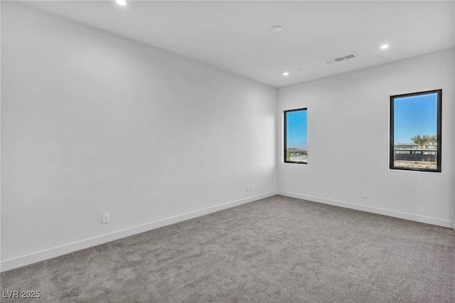 unfurnished room featuring carpet flooring