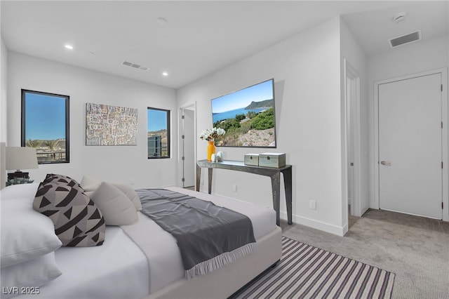 bedroom with light colored carpet