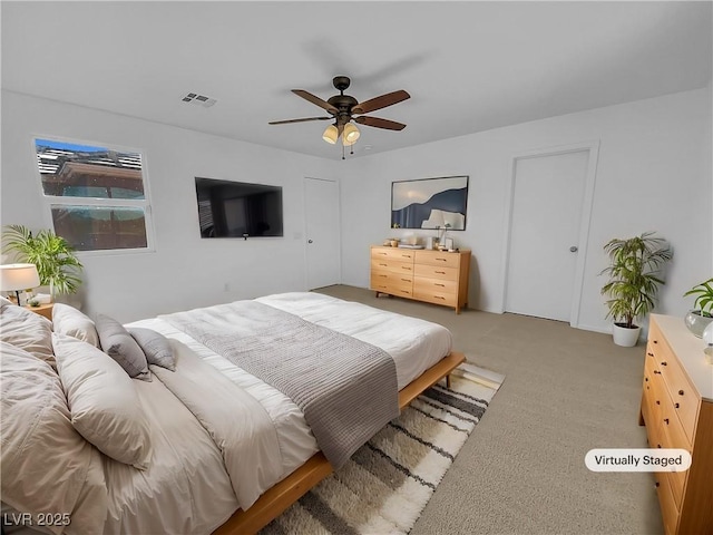 carpeted bedroom featuring ceiling fan