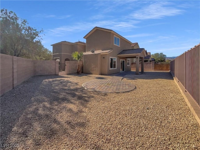 back of house featuring a patio