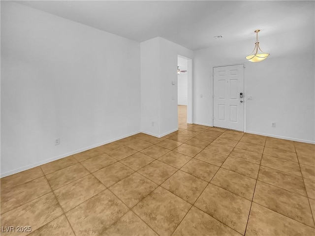 empty room with light tile patterned flooring