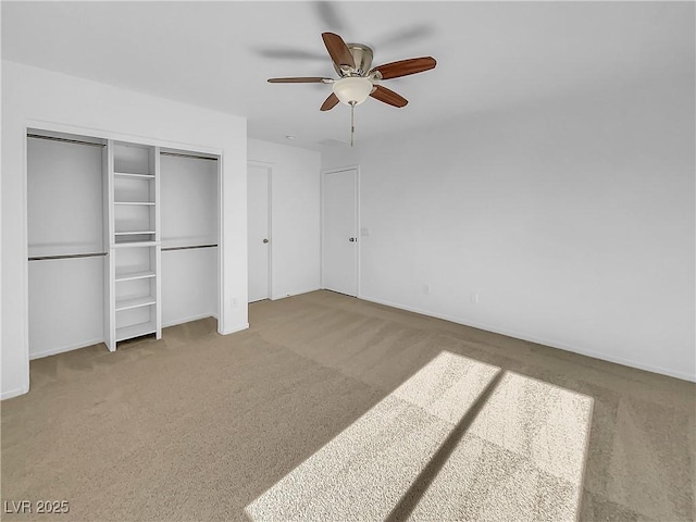 unfurnished bedroom featuring a closet, ceiling fan, and carpet flooring