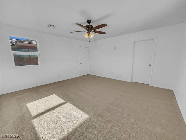 carpeted empty room with ceiling fan