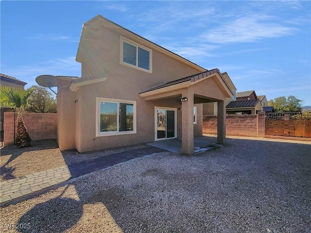 back of house featuring a patio