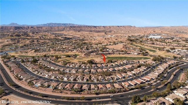 birds eye view of property with a mountain view