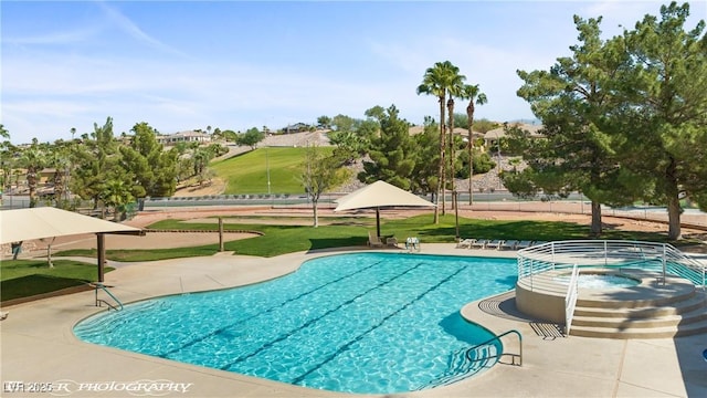 view of pool with a community hot tub and a patio