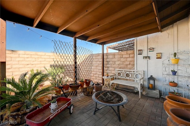 view of patio / terrace with a fire pit