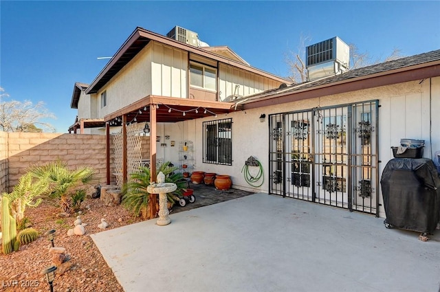 rear view of property with a patio and cooling unit