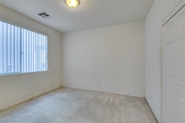 spare room with light colored carpet